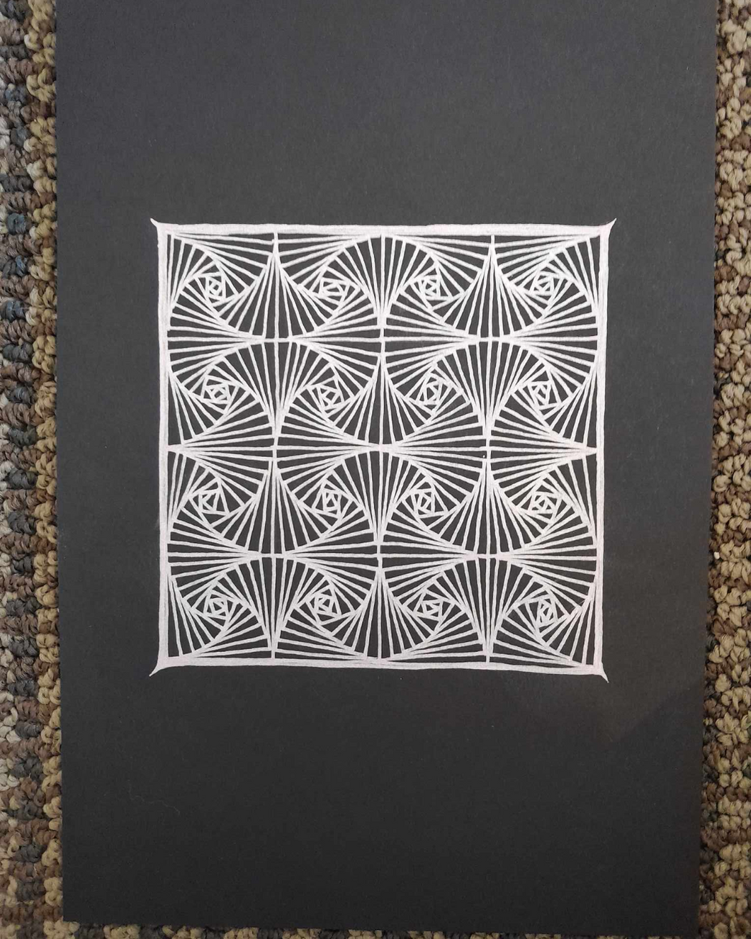 Repeating pattern zentangle in shiny gel pen.