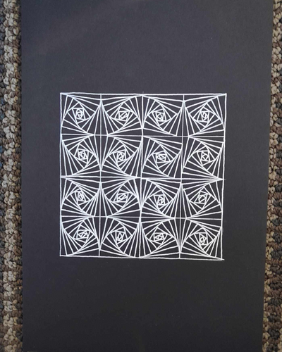 Repeating pattern zentangle in white gel pen.